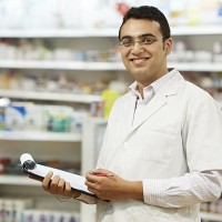 Pharmacy chemist woman in drugstore